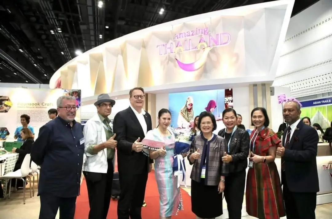 Suat Tore and other delegates posing in front of the “Amazing Thailand” booth at PATA Travel Mart 2024 in Bangkok, Thailand.