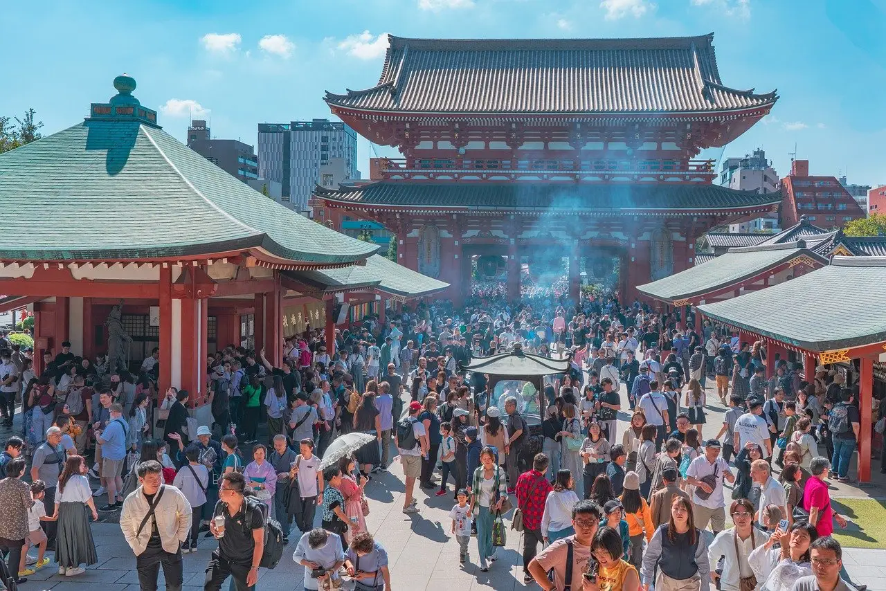 Crowds of tourists visiting Senso-ji Temple in Asakusa, Tokyo on a sunny day