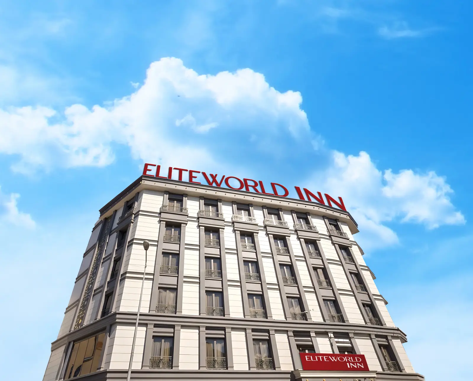 Elite World INN İstanbul Mahmutbey otelinin modern dış cephesi ve çatısındaki kırmızı tabelası, mavi gökyüzü önünde görülüyor.